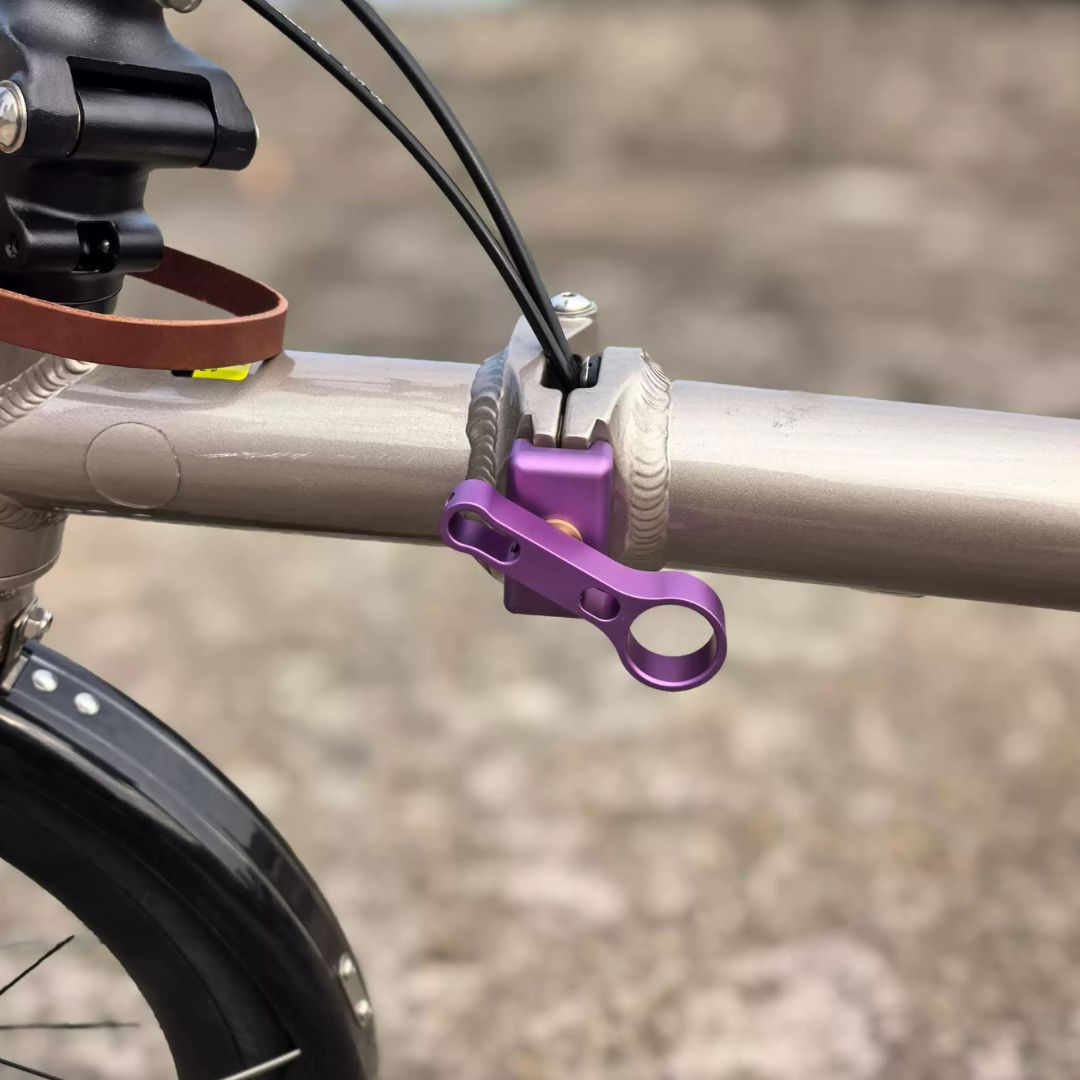 Mr TiParts Java Neo folding hinge clamp in purple, fitted on the main frame hinge